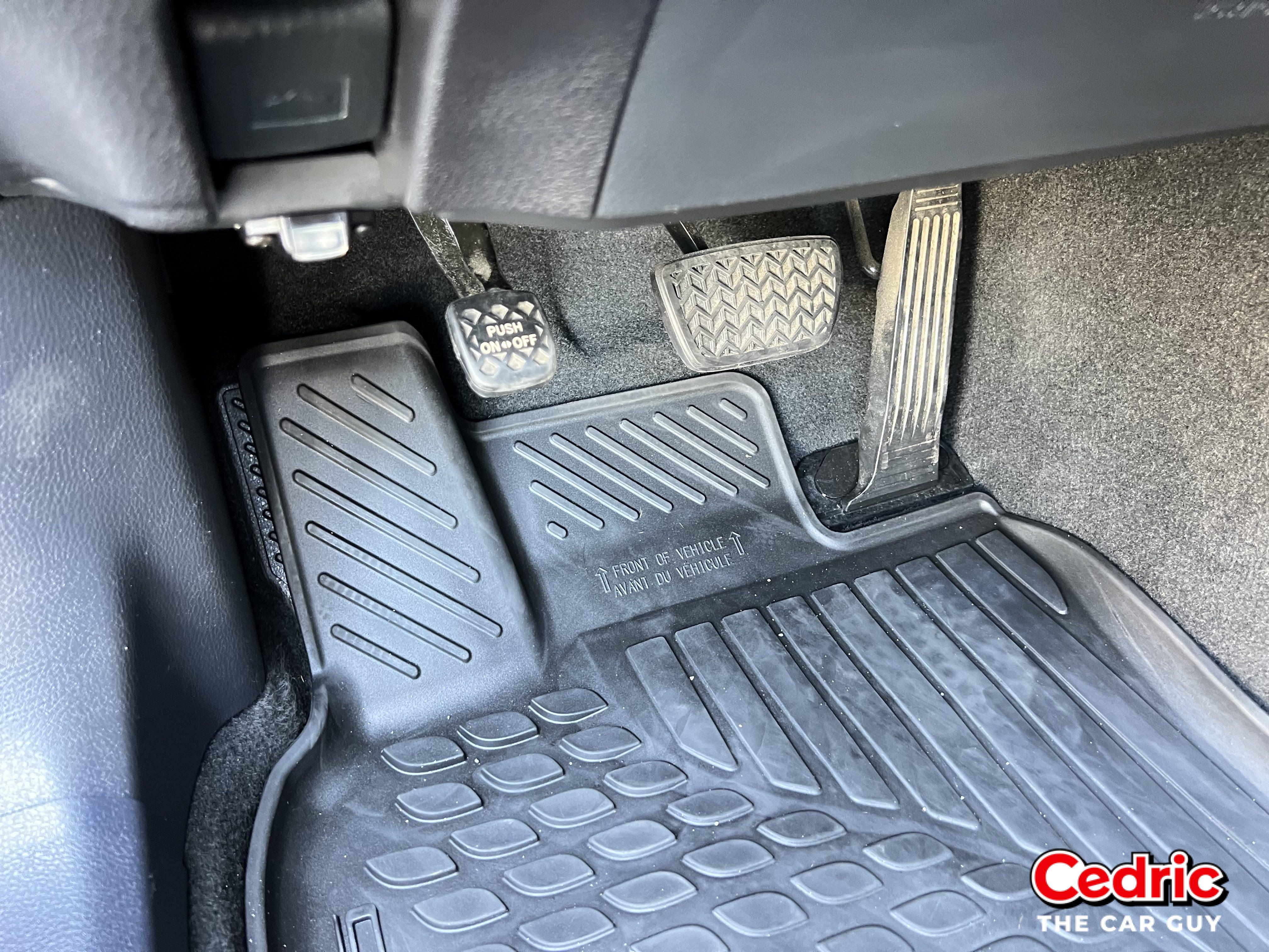 Toyota Footwell: The parking brake is on the left, the brake pedal with Toyota Brake Assist is in the middle, and the gas pedal is on the right.