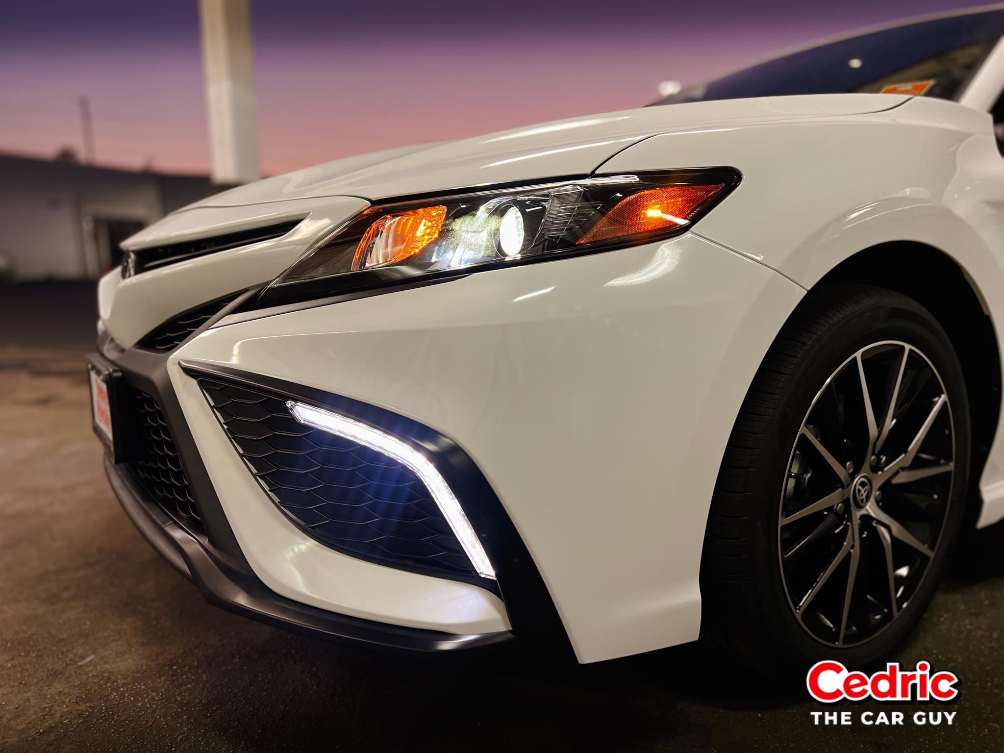 Automatic High Beams within the Projector Headlamps and LED Daytime Running Lights illuminated on the Toyota Camry SE