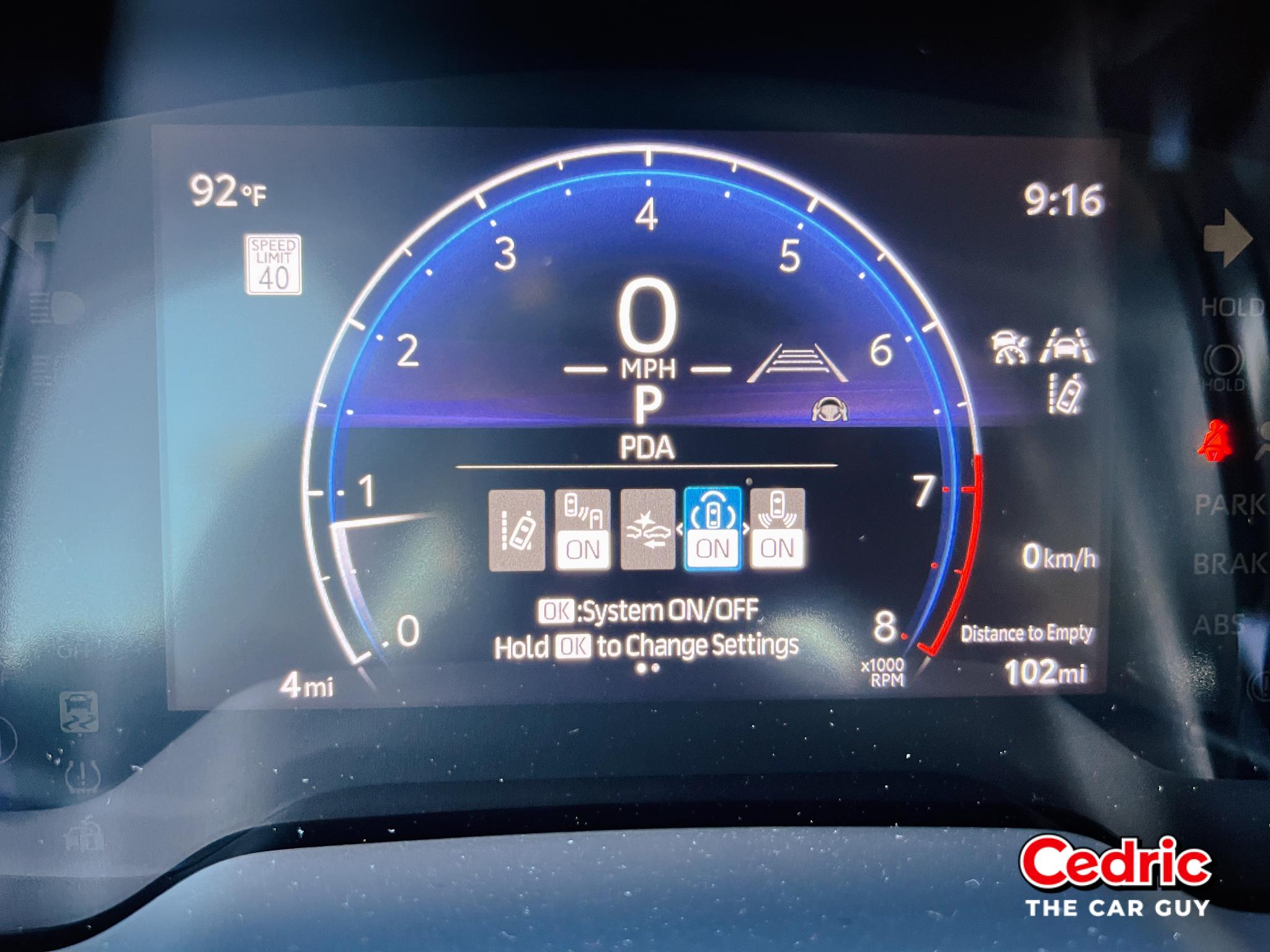 Proactive Driving Assist within the 7-inch Toyota MID shows the PDA's toggle status by highlighting the car inside a blue semi-triangular icon.