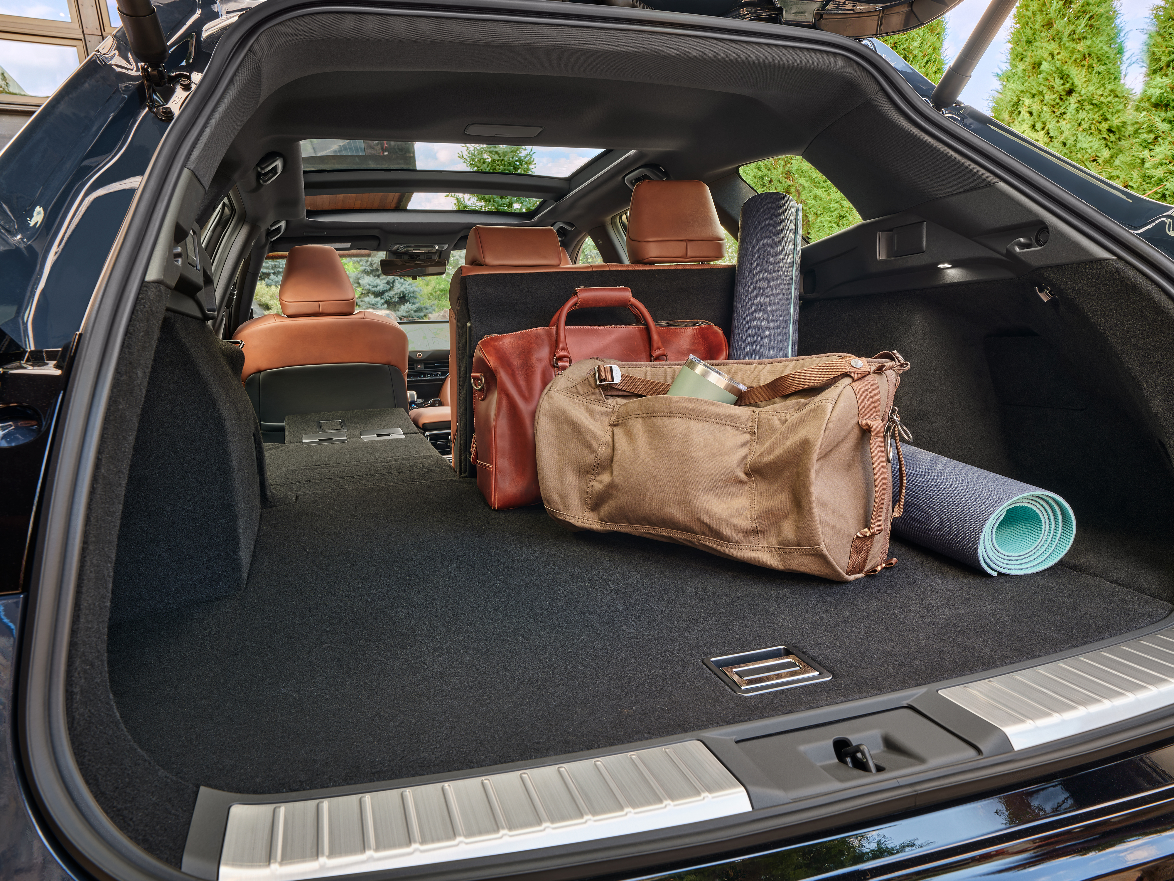 2025 Toyota Crown Signia Limited storage area with two large bags and two yoga mats