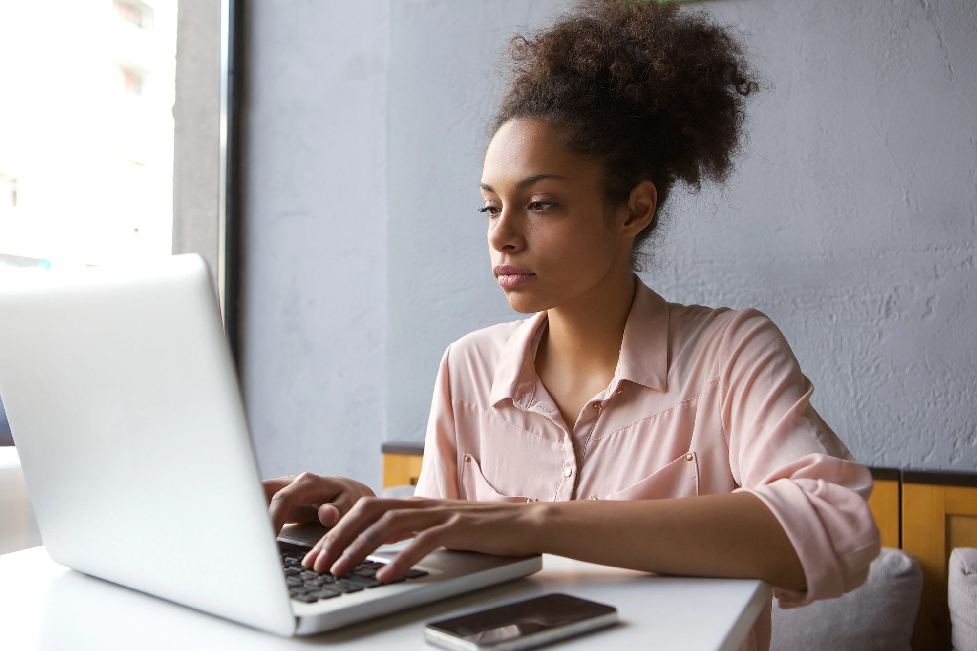 women doing online research on how to buy a car