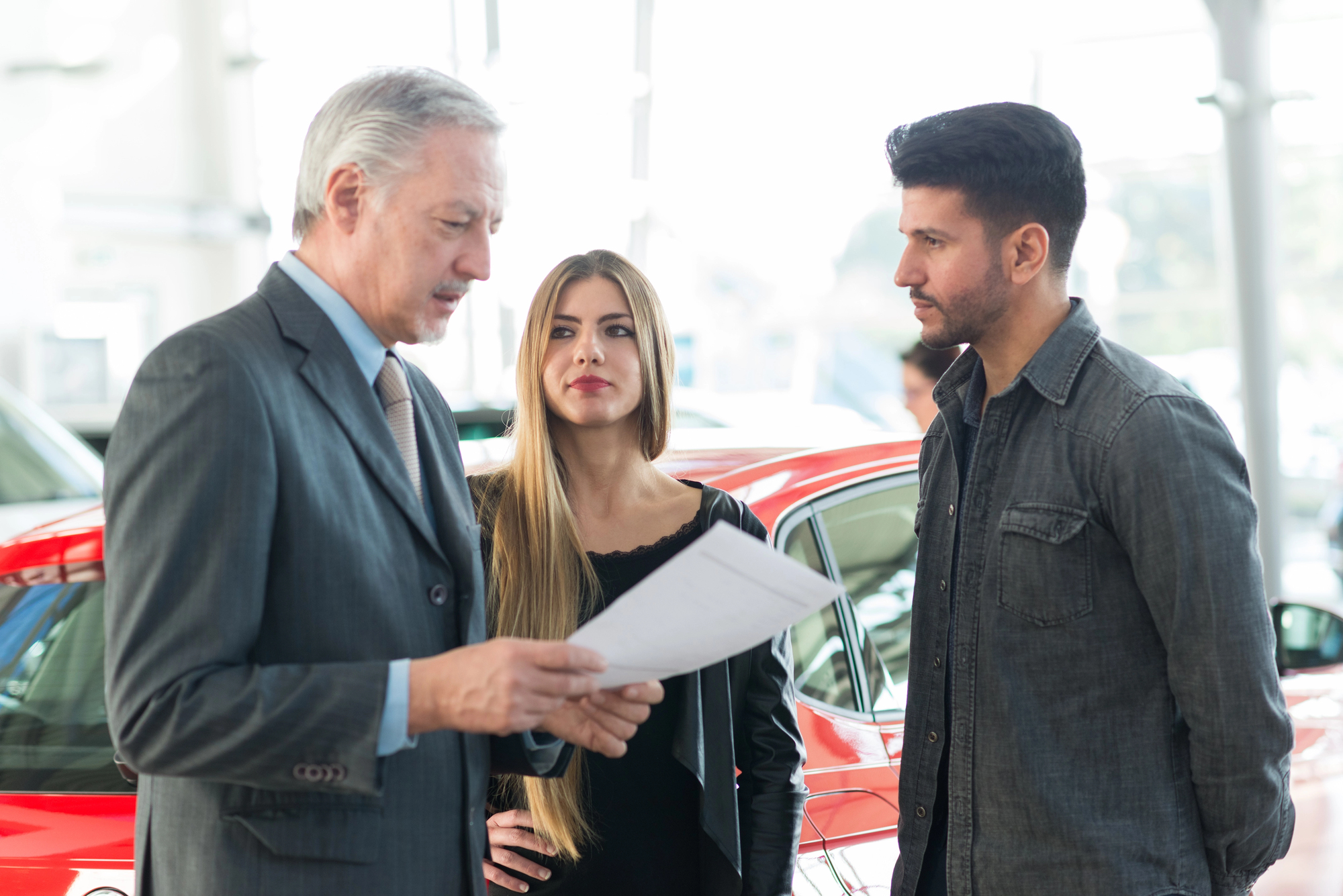 young couple attempts to outsmart a car salesman