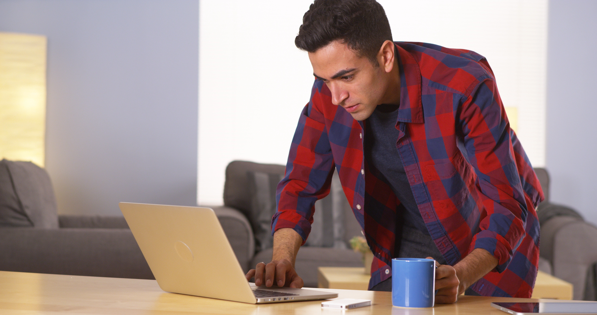 man doing research looking a car dealership inventory